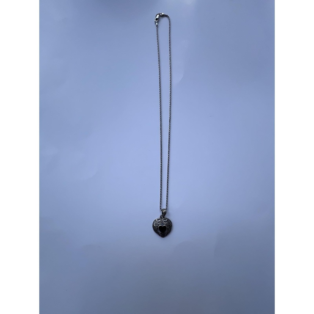 Silver chain with a heart-shaped pendant.